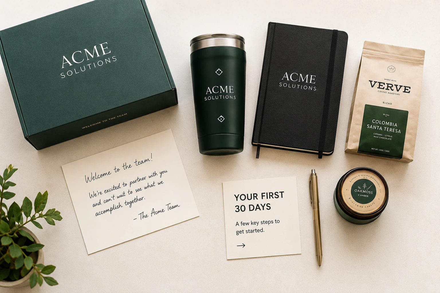 Overhead view of a curated customer welcome kit with branded packaging and useful items